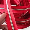 Vibrant red durable nickel-toothed #3 zipper, offering both style and functionality.