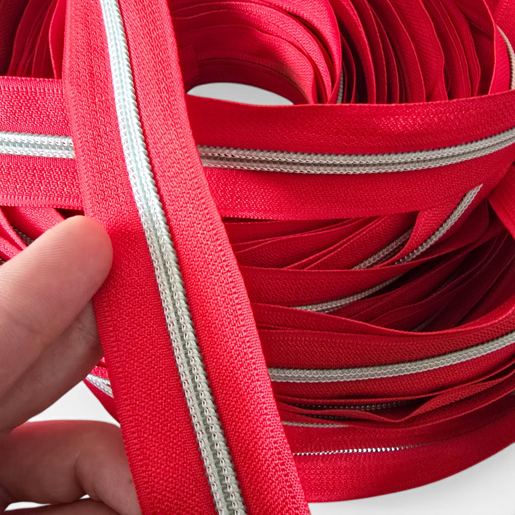 Vibrant red durable nickel-toothed #3 zipper, offering both style and functionality.